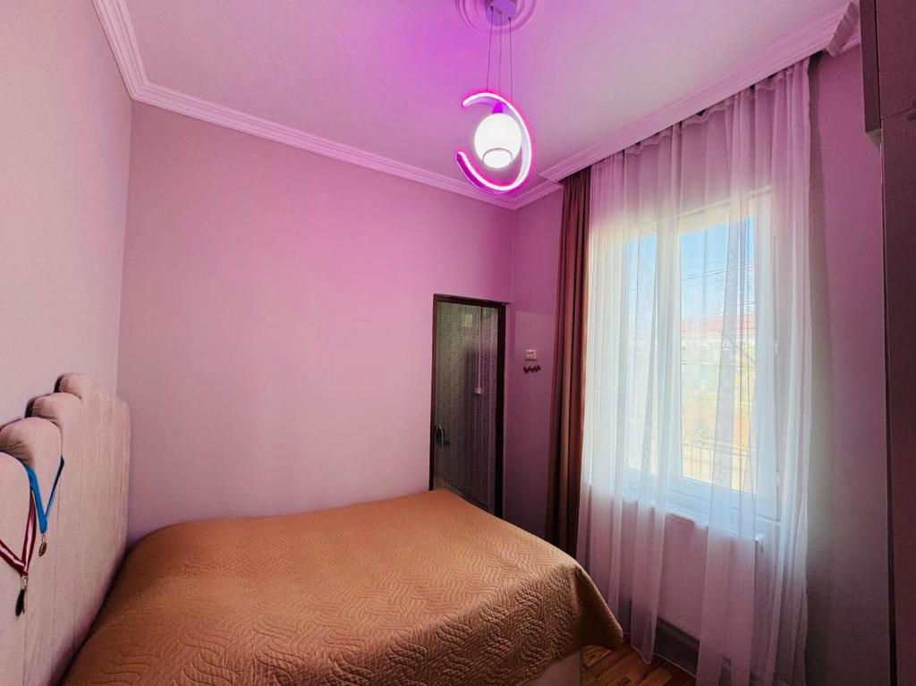 Postel nebo postele na pokoji v ubytování Ios Guest House