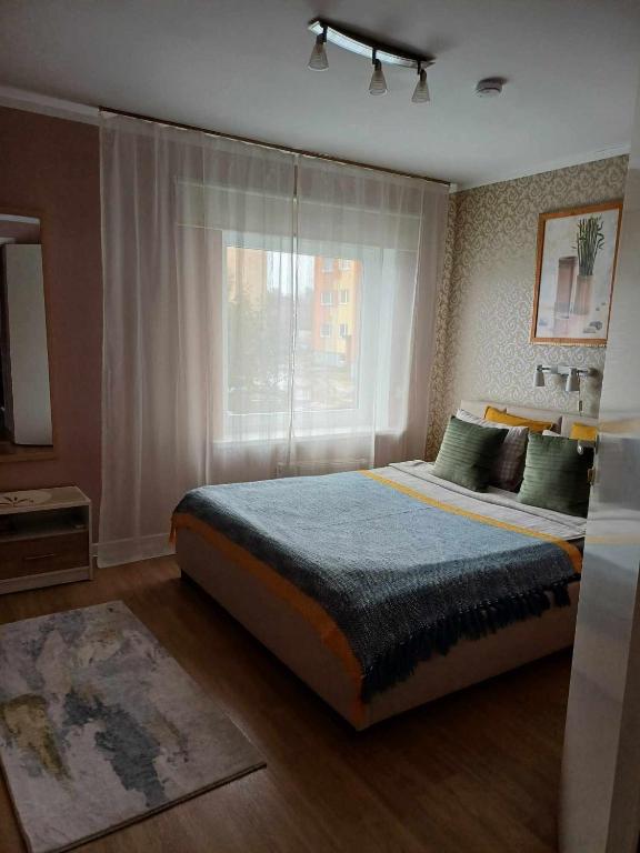 Postel nebo postele na pokoji v ubytování Liisu Külalistemaja