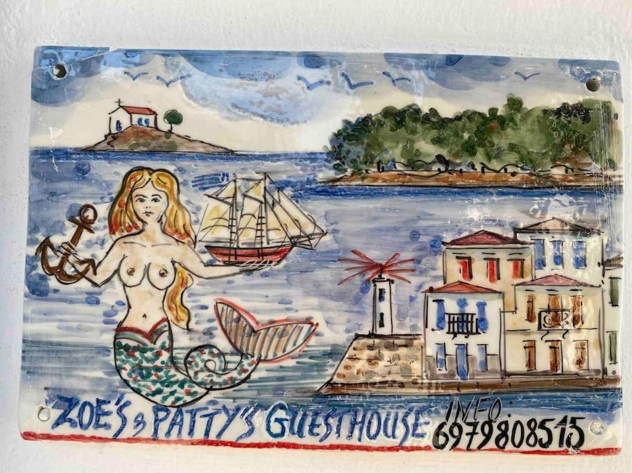 a drawing of a mermaid and a ship on a painting at Zoe’s & Patty’s Guest House in Galaxidhion