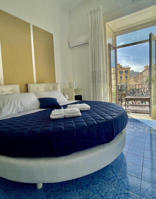 Postel nebo postele na pokoji v ubytování Ambasciata Sorrento Relais