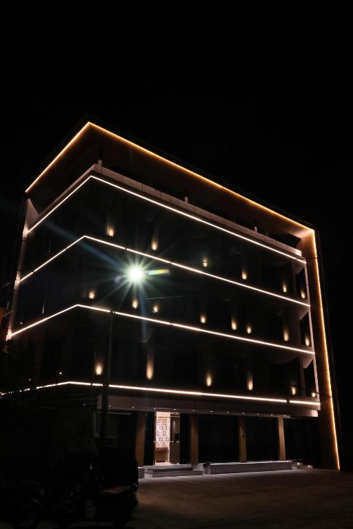 a building with lights on it at night at Beyond Blu in Port Blair