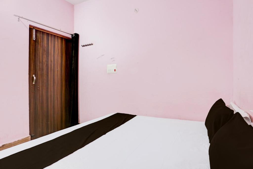 Postel nebo postele na pokoji v ubytování OYO Hotel Town 3 Star