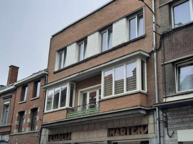 a large brick building with a balcony on it at LE PARADIS ATHOIS in Ath