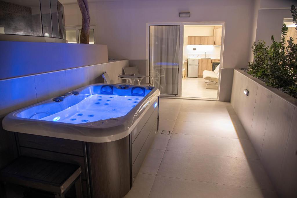 a bathroom with a jacuzzi tub in a room at Missiria Apartments in Rethymno