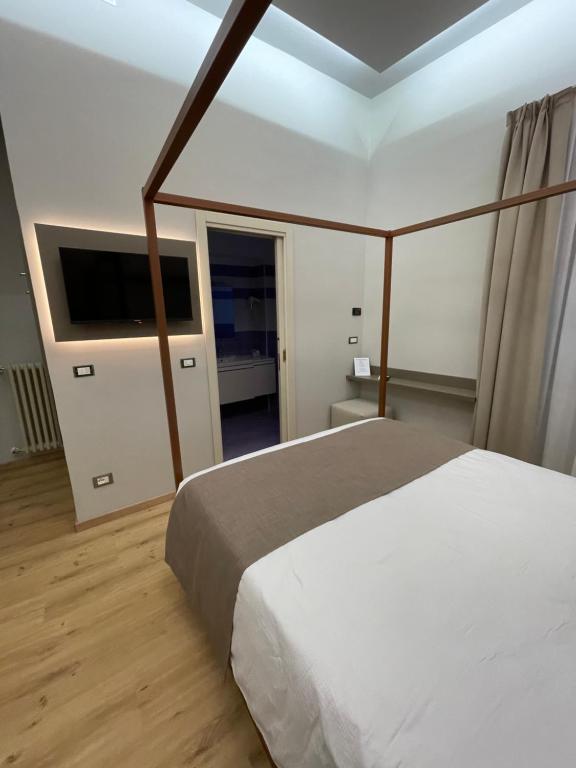 Postel nebo postele na pokoji v ubytování Hotel Central Giacomini