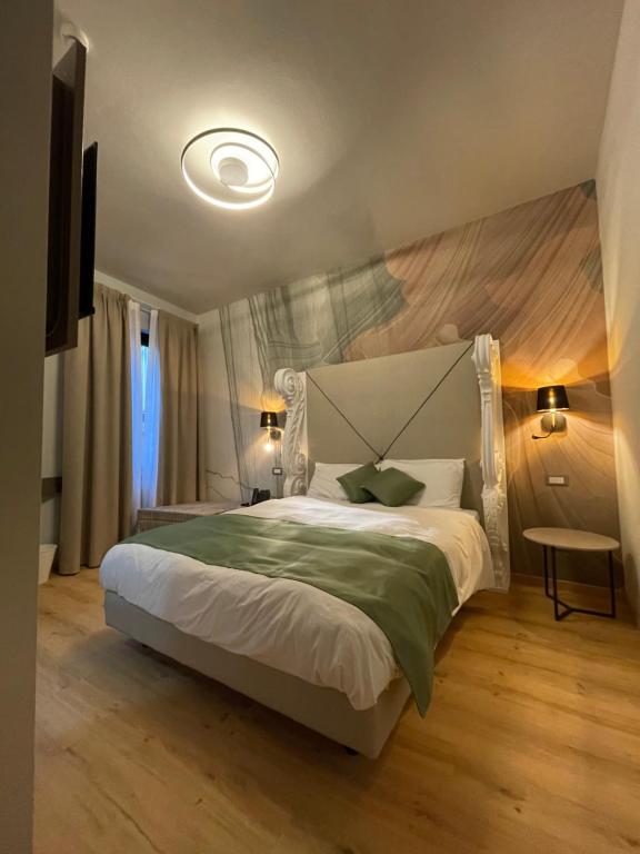 Postel nebo postele na pokoji v ubytování Hotel Central Giacomini
