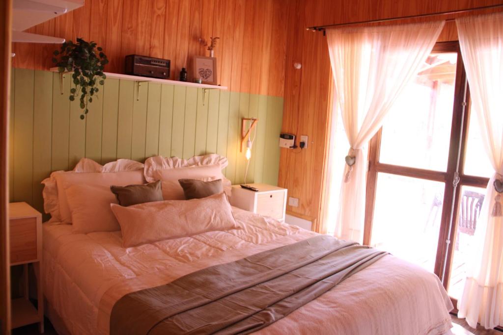 Postel nebo postele na pokoji v ubytování Akeka la casa del lago