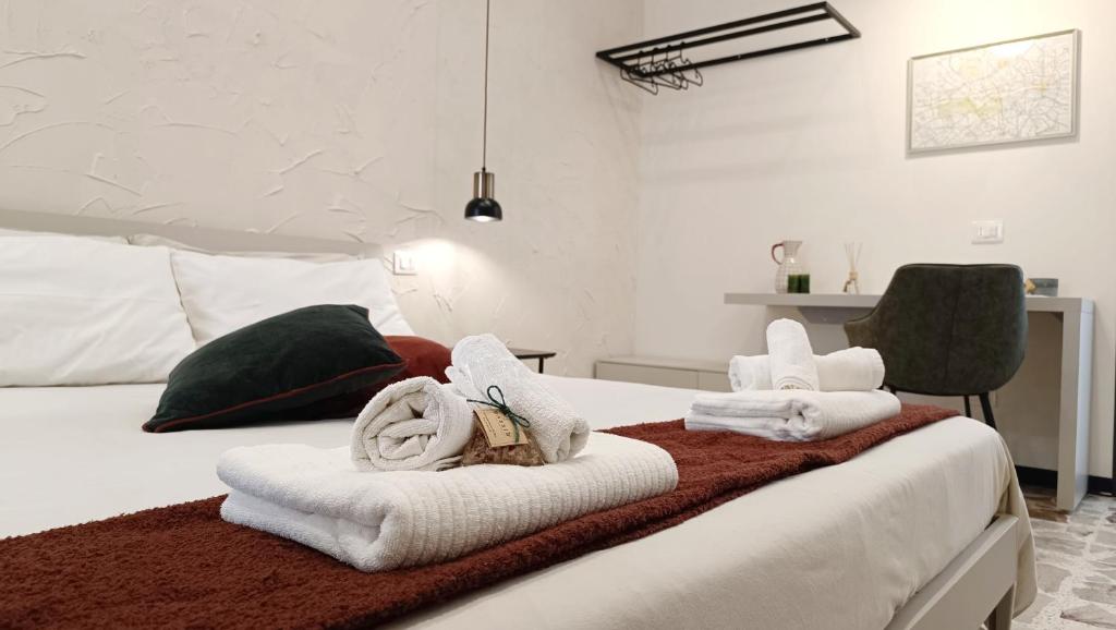 Posteľ alebo postele v izbe v ubytovaní Bassi77 - rooms & apartments