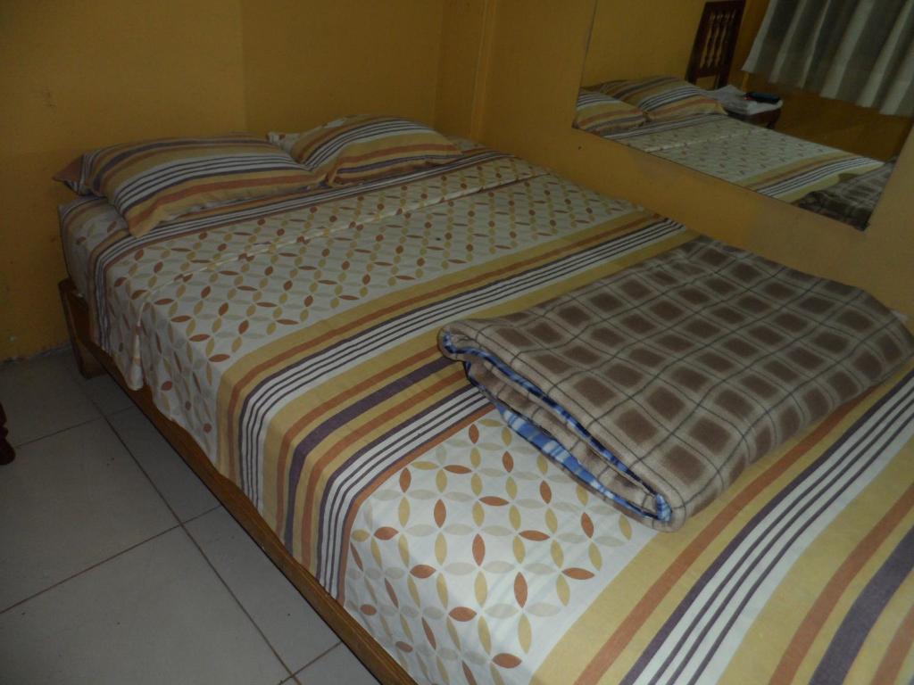 Postel nebo postele na pokoji v ubytování Hostal Jovita