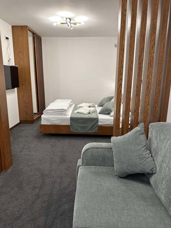 Postel nebo postele na pokoji v ubytování R&R Hotel