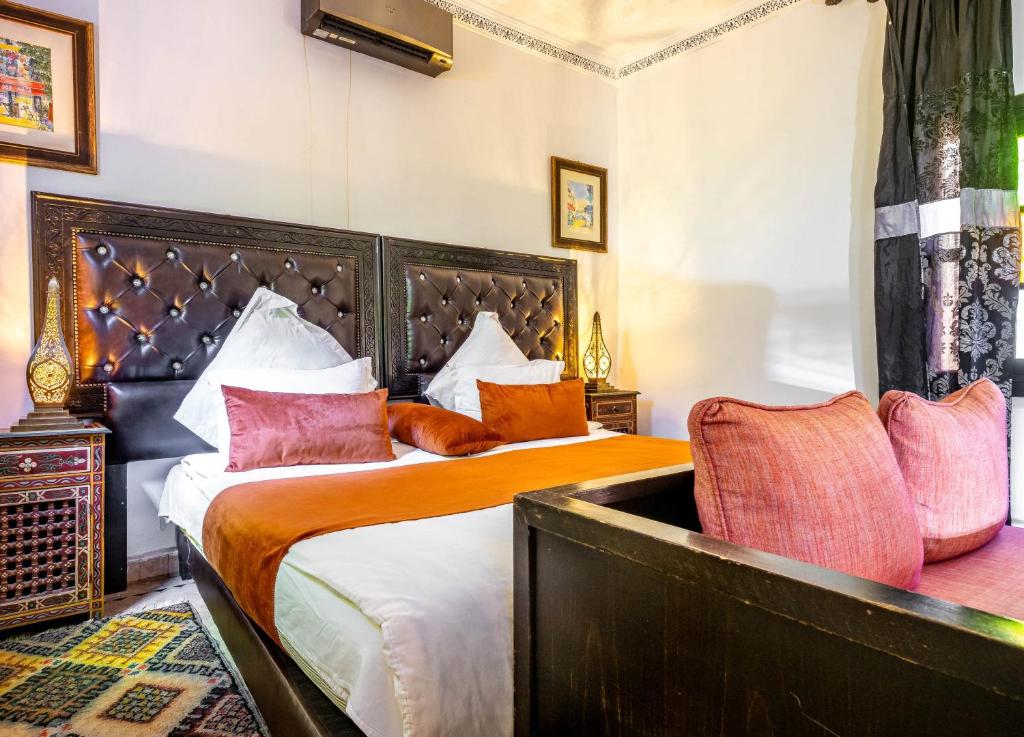 Postel nebo postele na pokoji v ubytování Kasbah Alili