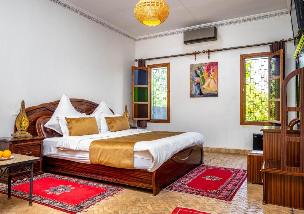 Postel nebo postele na pokoji v ubytování Kasbah Alili