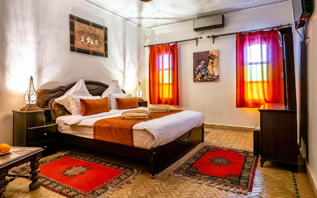 Postel nebo postele na pokoji v ubytování Kasbah Alili