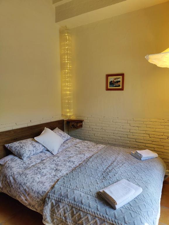 Postel nebo postele na pokoji v ubytování Cal Gat