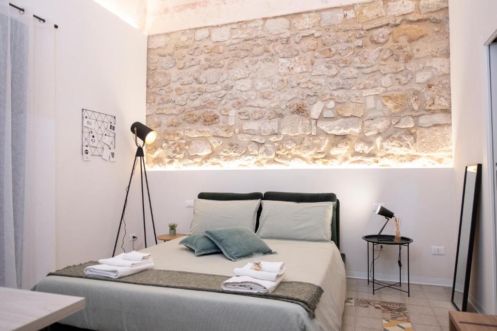 Posteľ alebo postele v izbe v ubytovaní Bassi77 - rooms & apartments