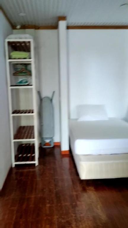 Postel nebo postele na pokoji v ubytování AHI Maldives