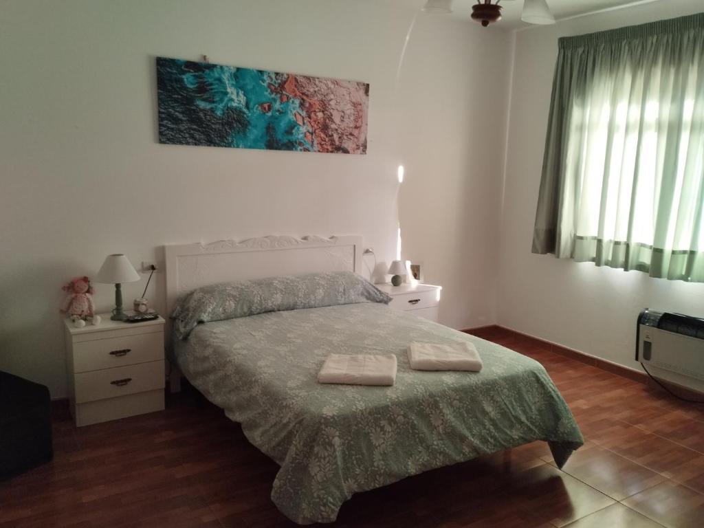 Łóżko lub łóżka w pokoju w obiekcie Villa Rica House