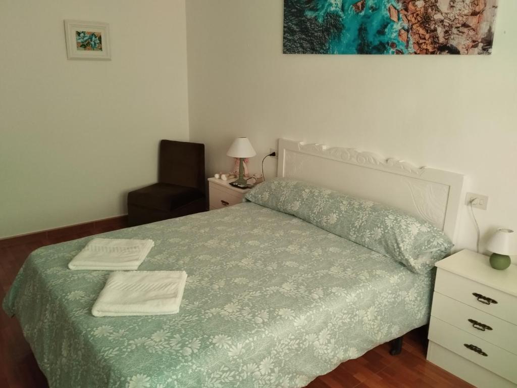 Łóżko lub łóżka w pokoju w obiekcie Villa Rica House