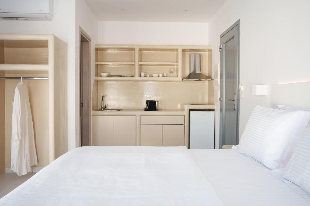 Postel nebo postele na pokoji v ubytování Bedspot Apartments Paros