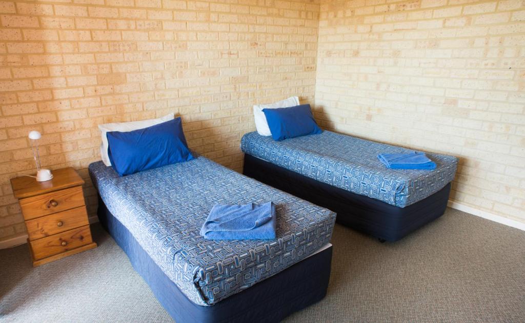 Postel nebo postele na pokoji v ubytování Kalbarri Palm Resort