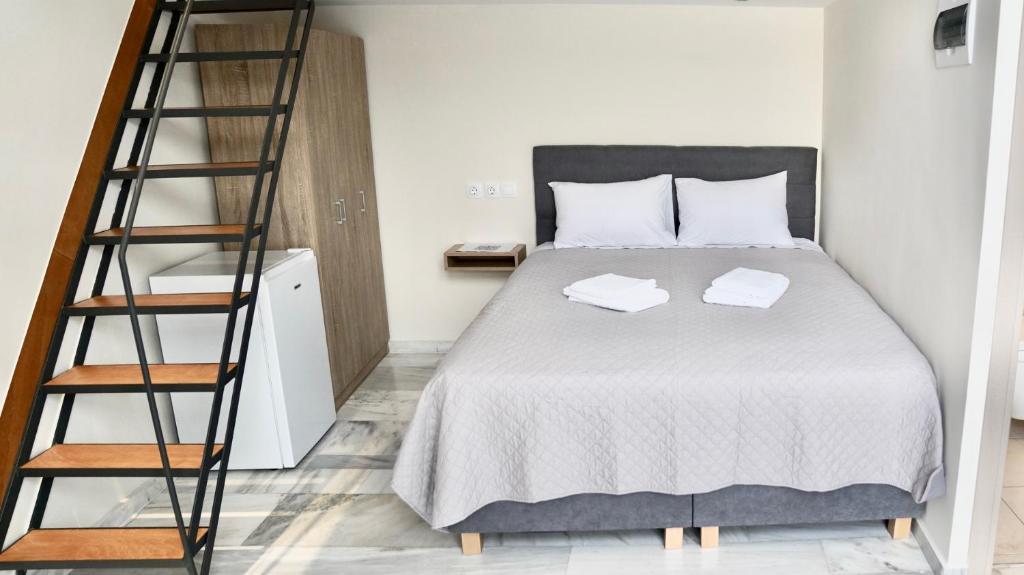 Postel nebo postele na pokoji v ubytování Piraeus Relax