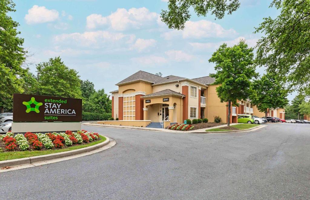 a hotel with a sign in front of a building at Extended Stay America Suites Washington DC Germantown Town Center in Germantown