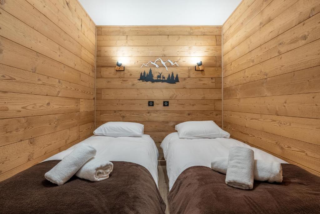 Tempat tidur dalam kamar di Appartement chalet Parking