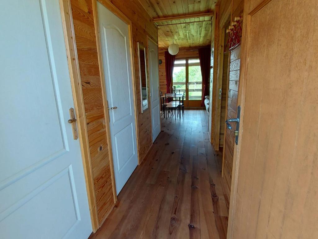 a hallway of a house with wooden floors and a door at Gîte Velle-sur-Moselle, 3 pièces, 4 personnes - FR-1-584-108 in Velle-sur-Moselle