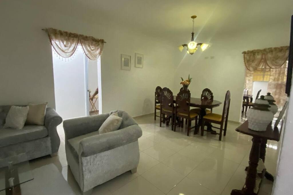 a living room with a couch and a table at La Castillada House in Santa Cruz de Barahona