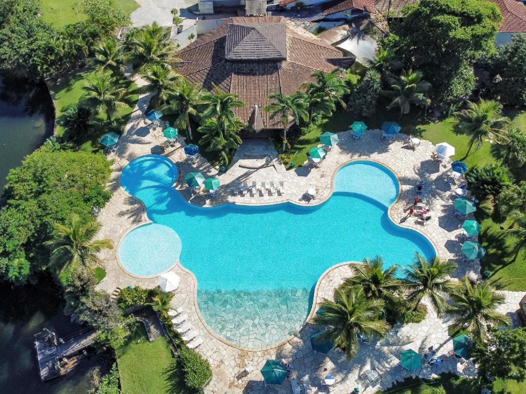 an overhead view of a pool at a resort at Flat Incrível - Livyd Angra dos Reis - Hotel do Bosque 3p in Angra dos Reis