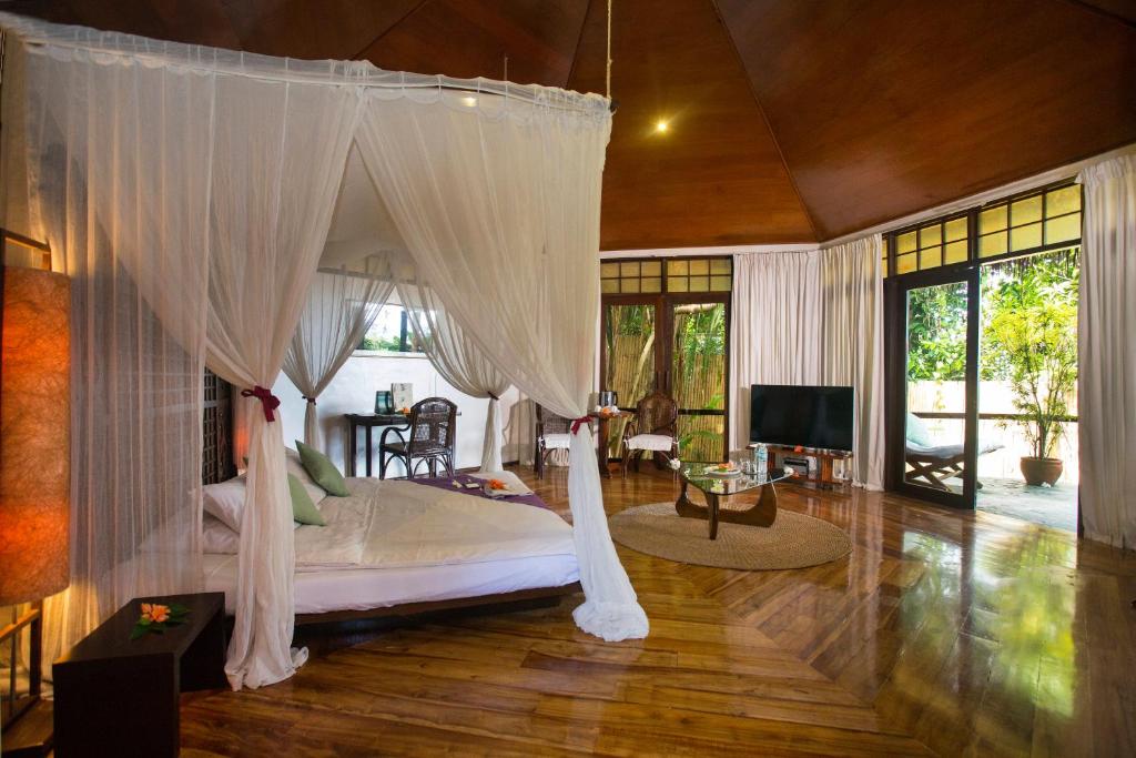 Postel nebo postele na pokoji v ubytování Mandala Spa & Resort Villas