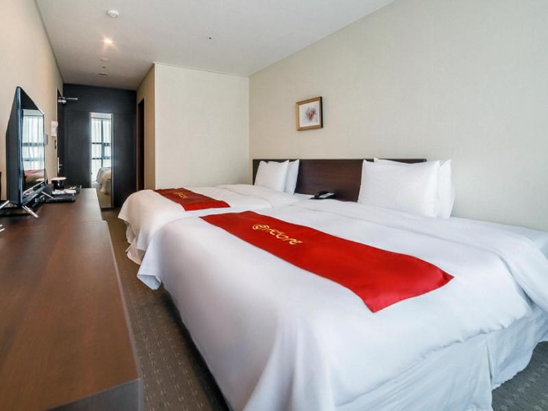 Postel nebo postele na pokoji v ubytování Hotel K-Tree Pyeongtaek