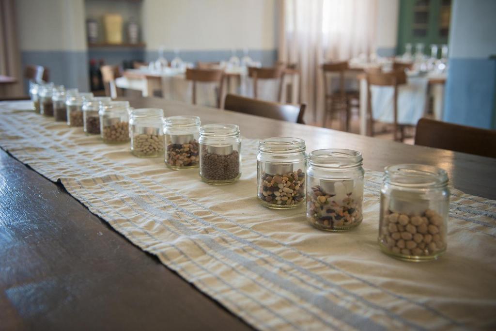 a long line of jars of food on a table at Villa Sant'Angelo in Alba Adriatica