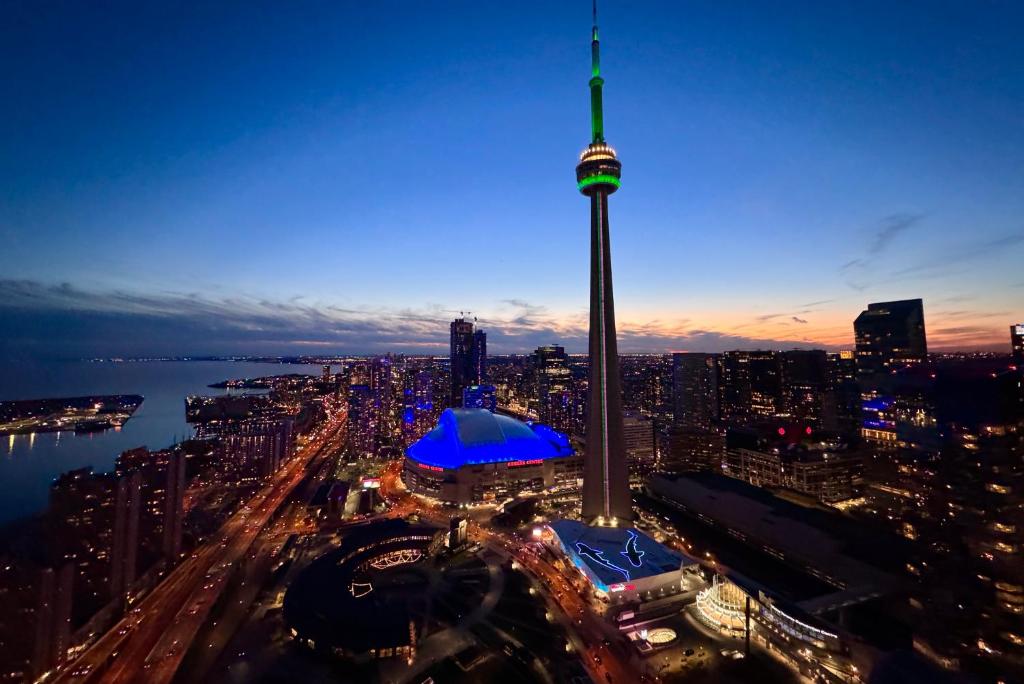 a view of the cn tower at night at Downtown Dream in Toronto