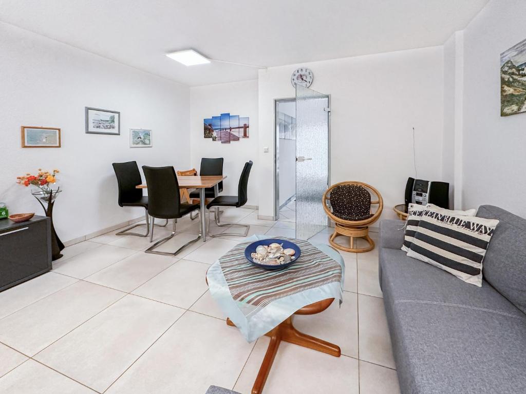 a living room with a couch and a table at Reihenendhaus Marina Sol in Dahme