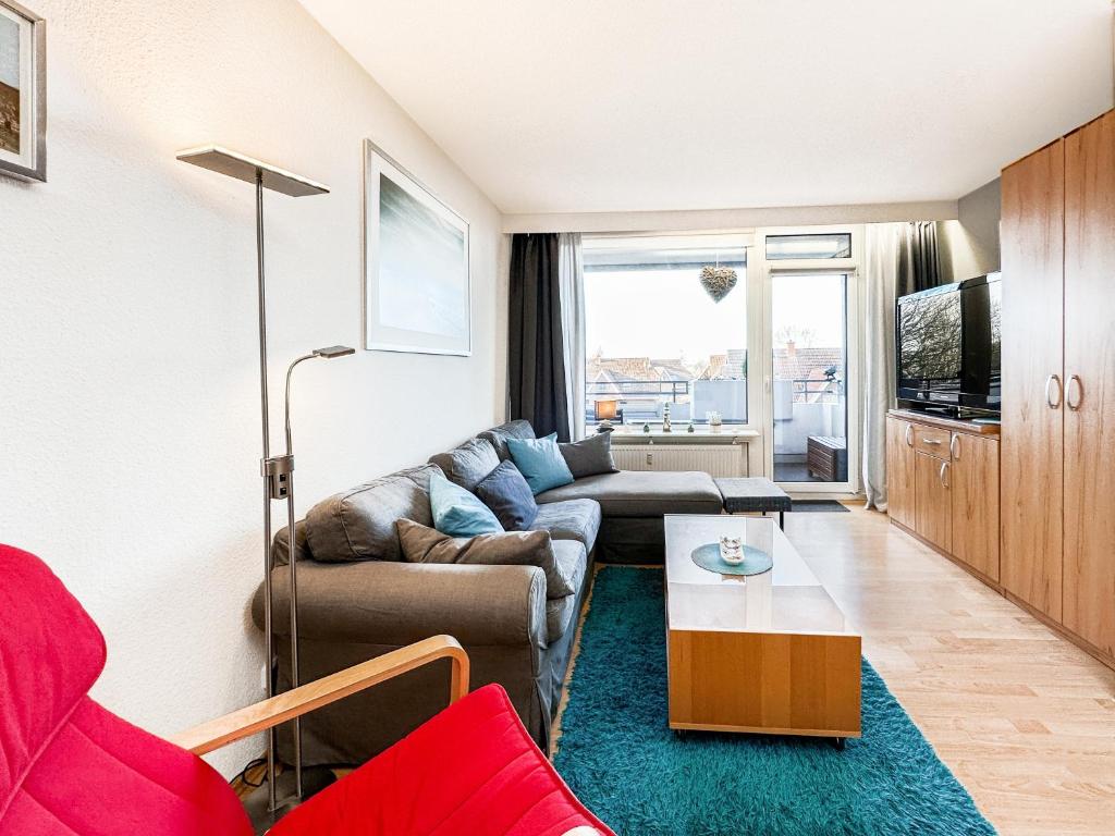 a living room with a couch and a table at FeWo Ferienglück Berolina 131 in Dahme