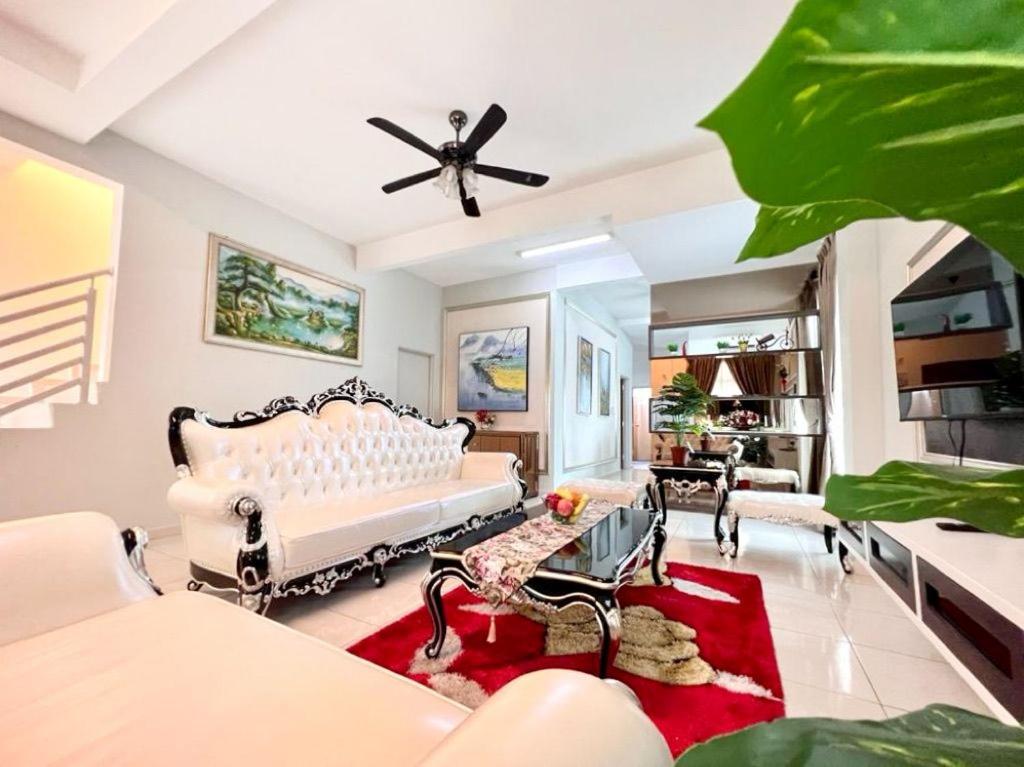a living room with a white couch and chairs at AI Home 3 at Melaka City for Big Group in Melaka