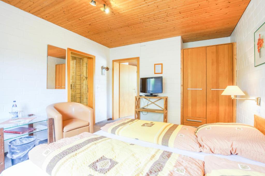 Postel nebo postele na pokoji v ubytování Pension Lindenkrug