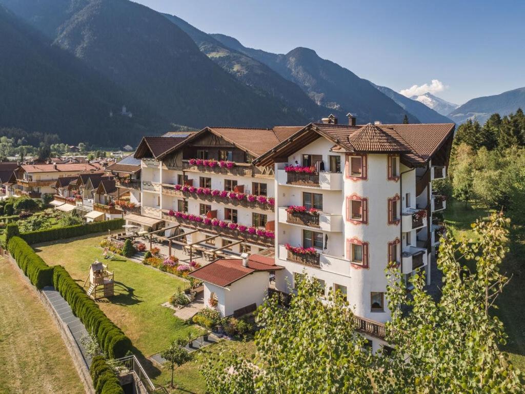 an aerial view of a hotel with mountains in the background at in het Aparthotel Panorama in Gais