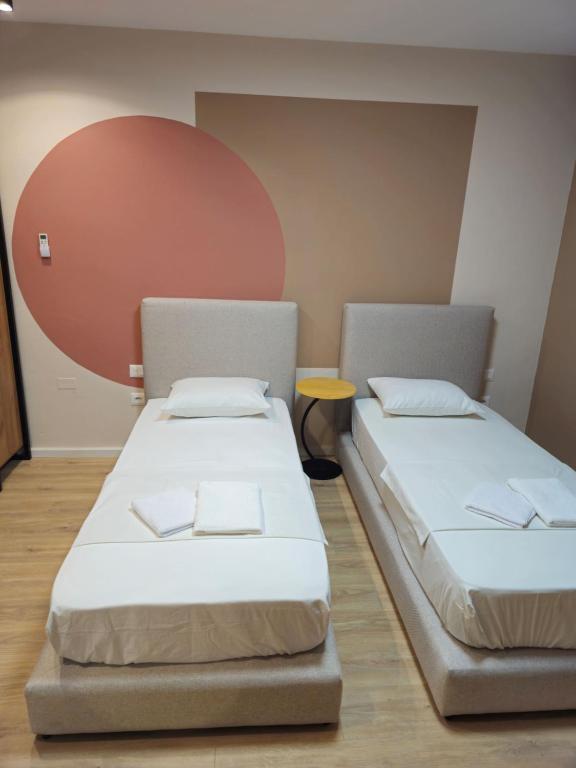 Postel nebo postele na pokoji v ubytování Center Cozy Nest