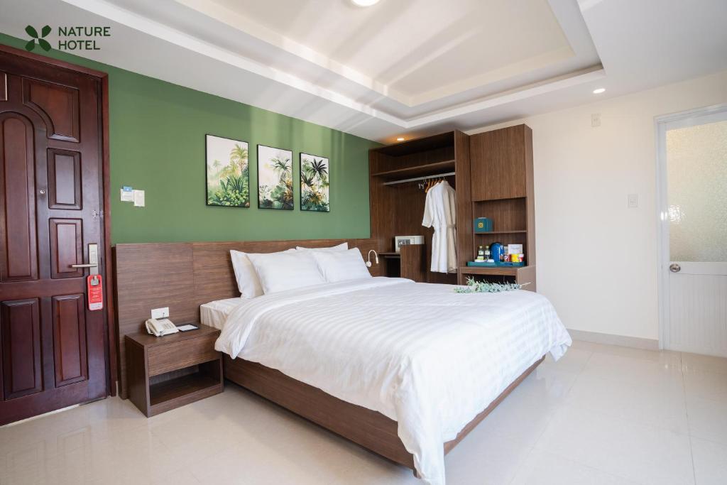 Giường trong phòng chung tại Nature Hotel - Dalat 3
