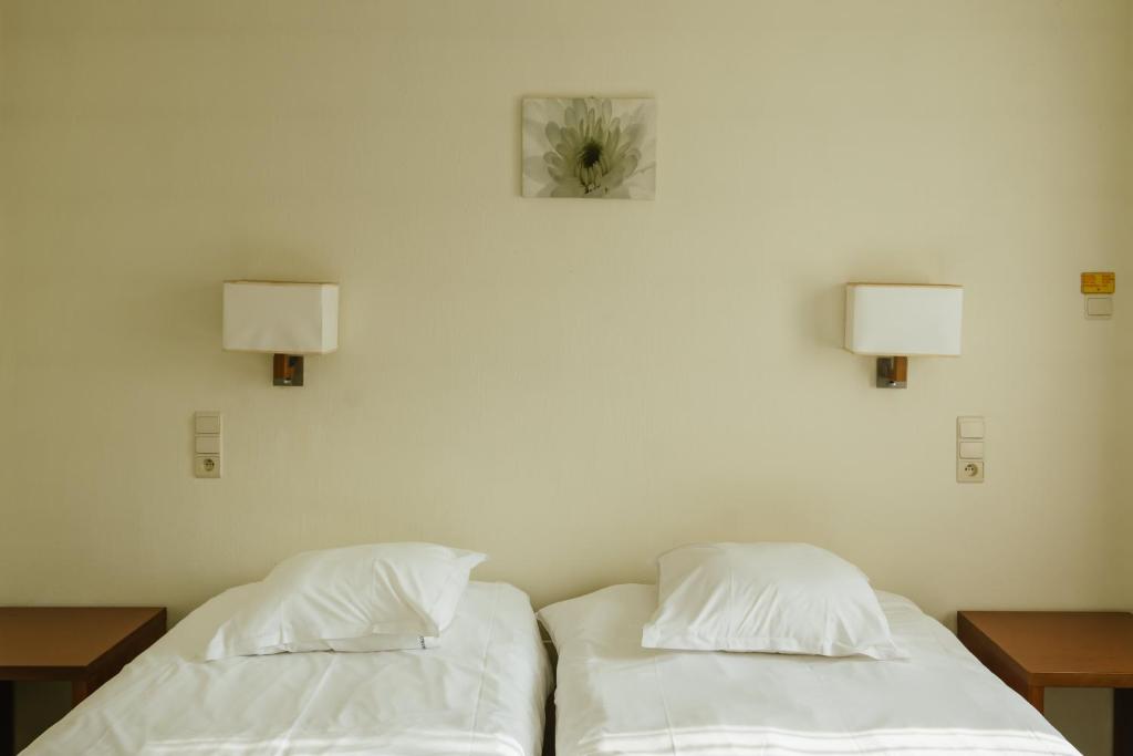 Postel nebo postele na pokoji v ubytování Hotel Kempenrust