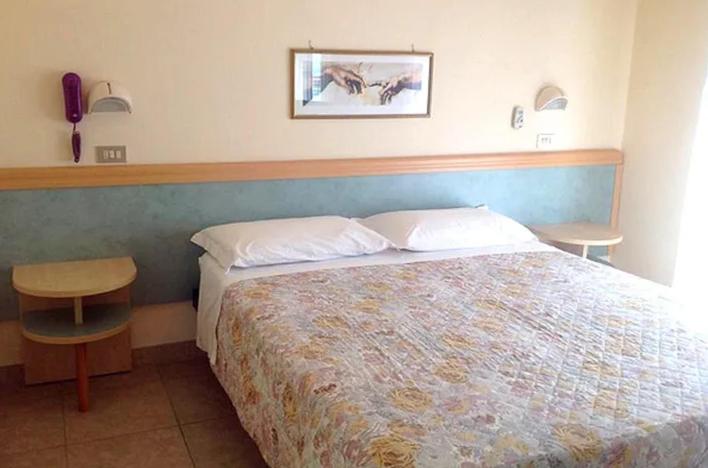 Postel nebo postele na pokoji v ubytování Hotel Anita