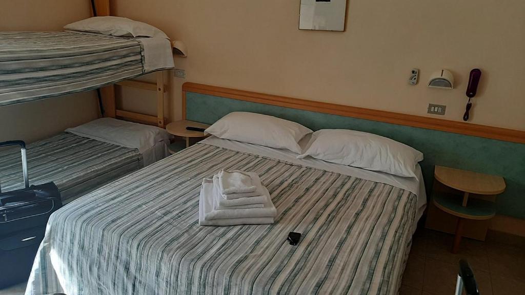 Postel nebo postele na pokoji v ubytování Hotel Anita