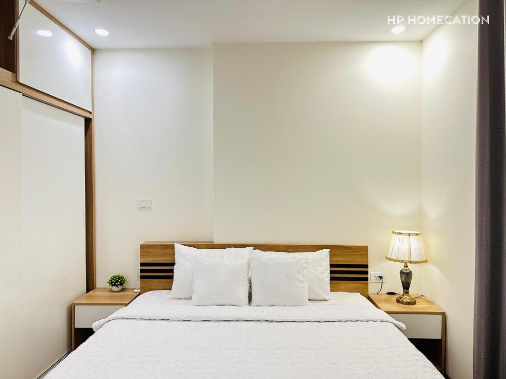 Een bed of bedden in een kamer bij HP HOMECATION