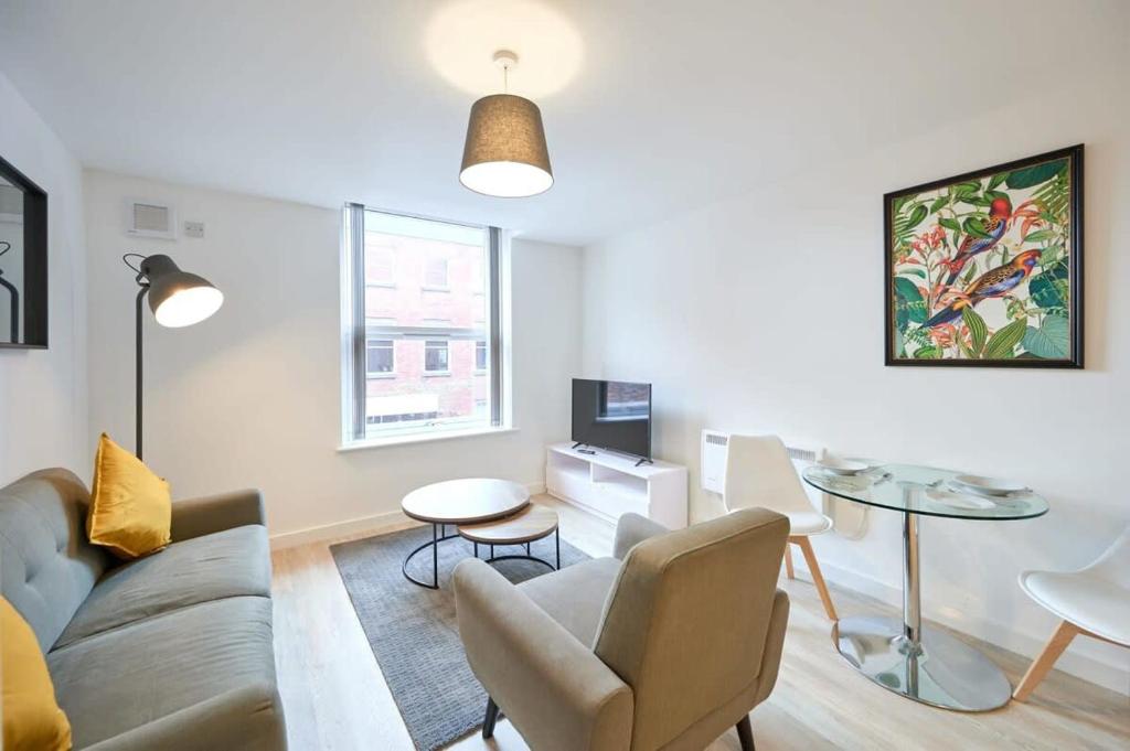 a living room with a couch and a table at Fabulous 1 Bedroom Apartment in Central Preston in Preston