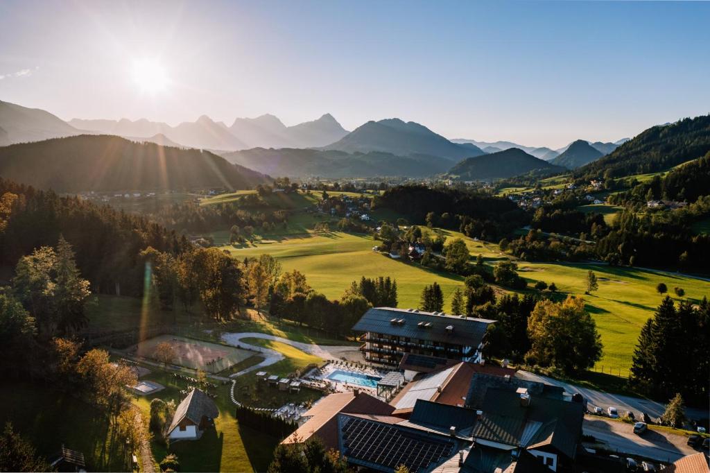 an aerial view of a resort with mountains in the background at Hotel Sperlhof in Windischgarsten