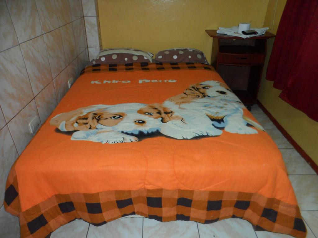Postel nebo postele na pokoji v ubytování Hostal Jovita