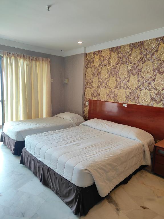 Postel nebo postele na pokoji v ubytování BAYU BEACH RESORT