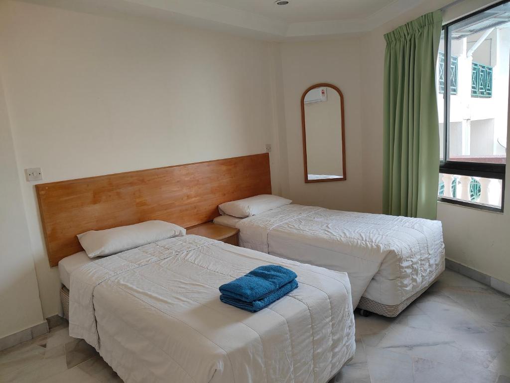 Postel nebo postele na pokoji v ubytování BAYU BEACH RESORT